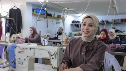 A garment worker in Gaza, engaged through the ILO–PEF Business Recovery Initiative. Gaza, the Occupied Palestinian Territory- May 2026