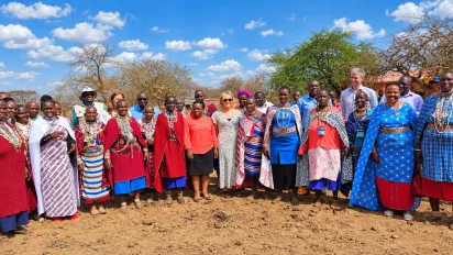 ILO project staff and donors stand for a group photo with Masai workers in Kajiado County, Kenya.