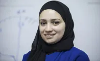 A woman posing for camera