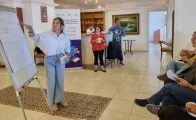 a trainer giving a lesson and explaining from a chart board