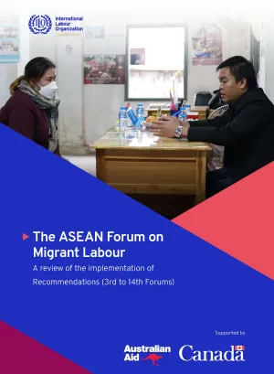 A woman consults a staff in a Migrant Worker Resource Centre. 