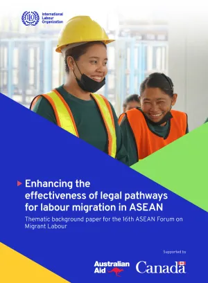 Two migrant women construction workers smile. Image of the publication: Thematic background paper for the 16th ASEAN Forum on Migrant Labour