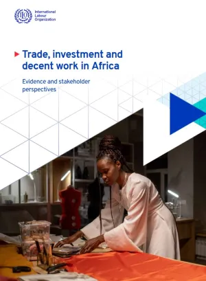 Cover of the report Trade, investment and decent work in Africa. A picture shows a woman works with orange fabric on a table in a fashion design workshop.