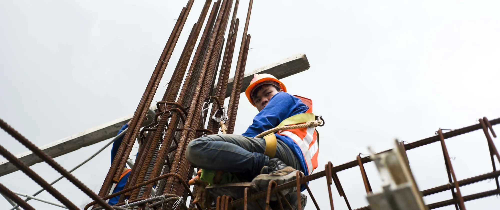 A man with safety belt at a construction site in the Philippines