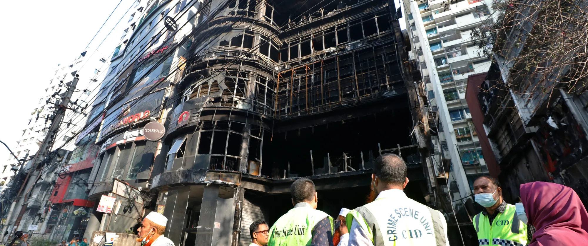 Rescue personnel outside the Green Cozy Cottage building on Dhaka's Bailey Road killing more than 40 people