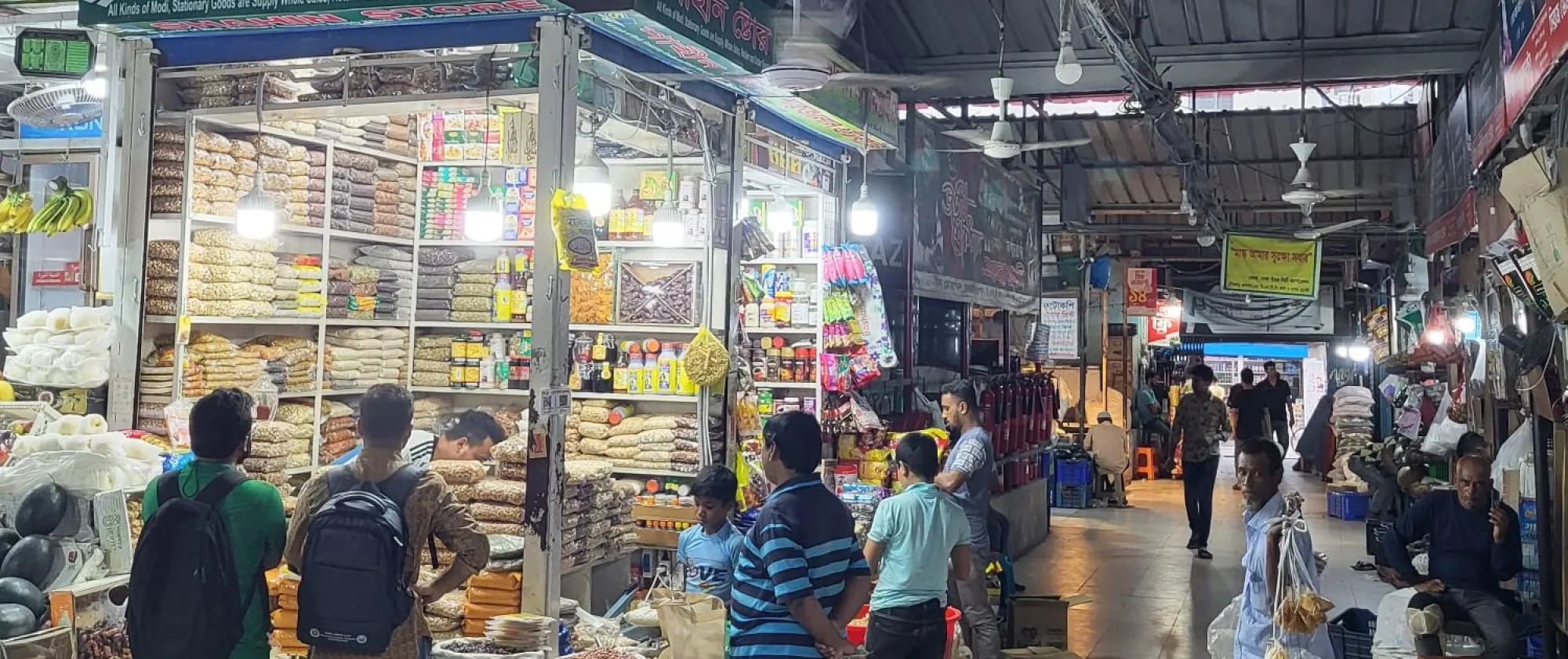 People shopping at a market in Dhaka, Bangladesh