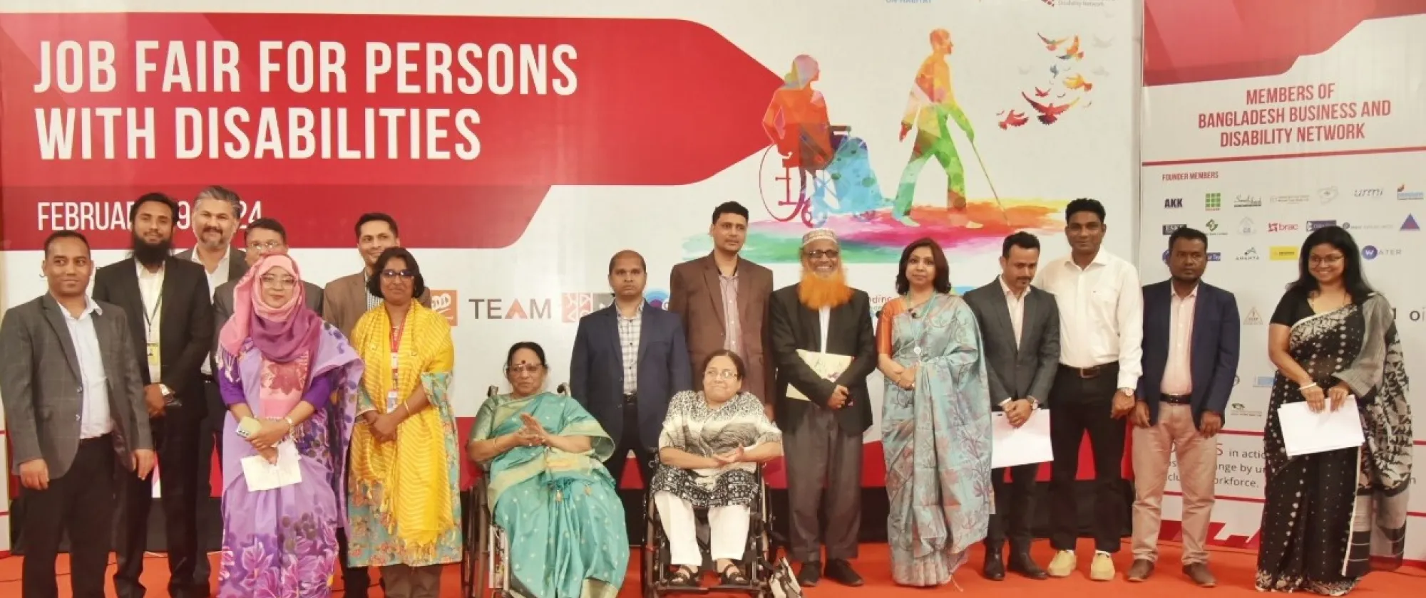 Organizers and participants of a job fair for persons with disability pose for a photo