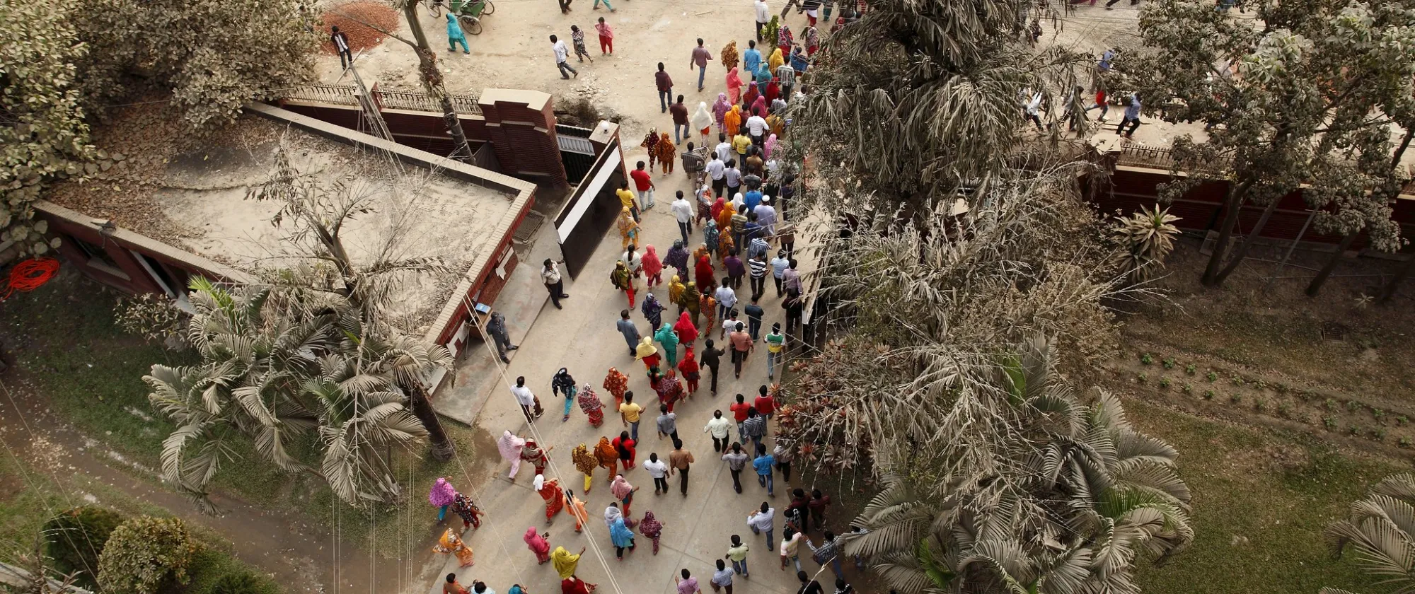 Bangladeshi workers leave work at the end of day