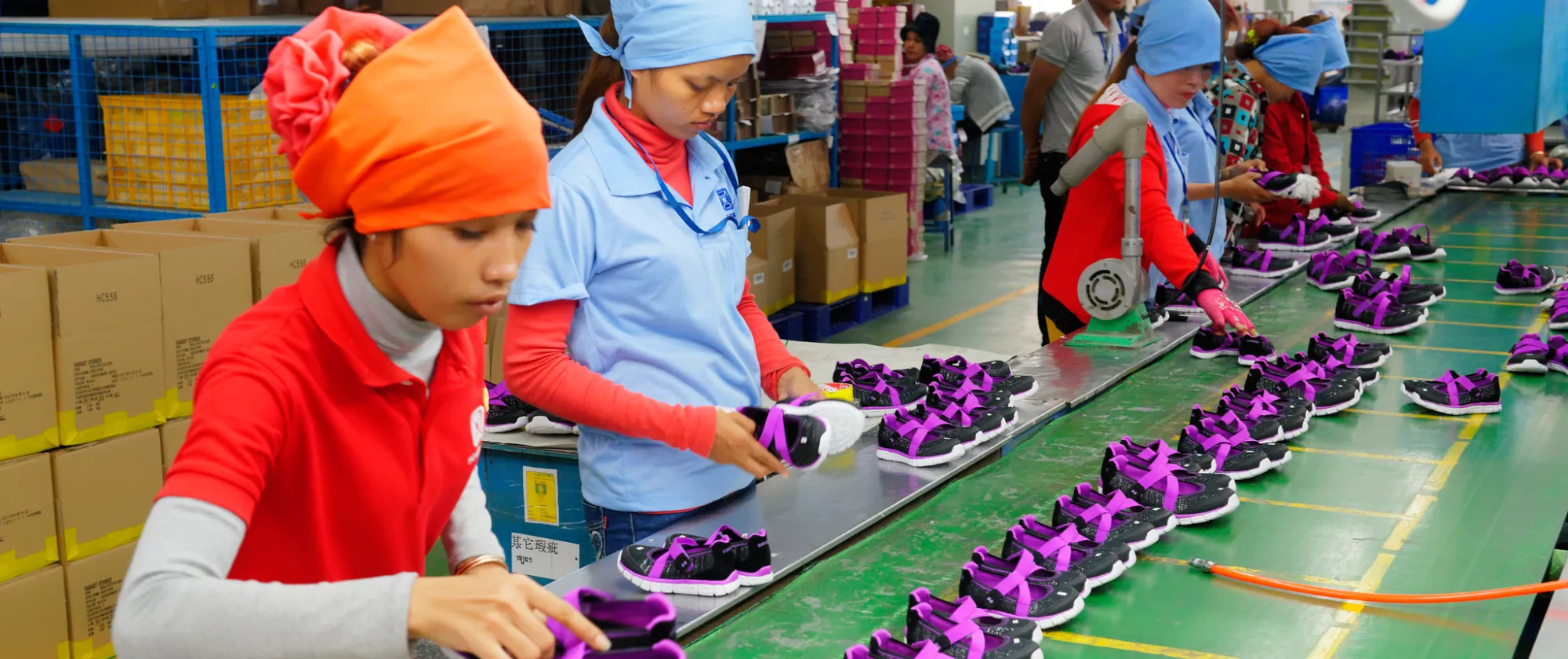  Cambodian workers are seen in a local footwear manufacturing plant