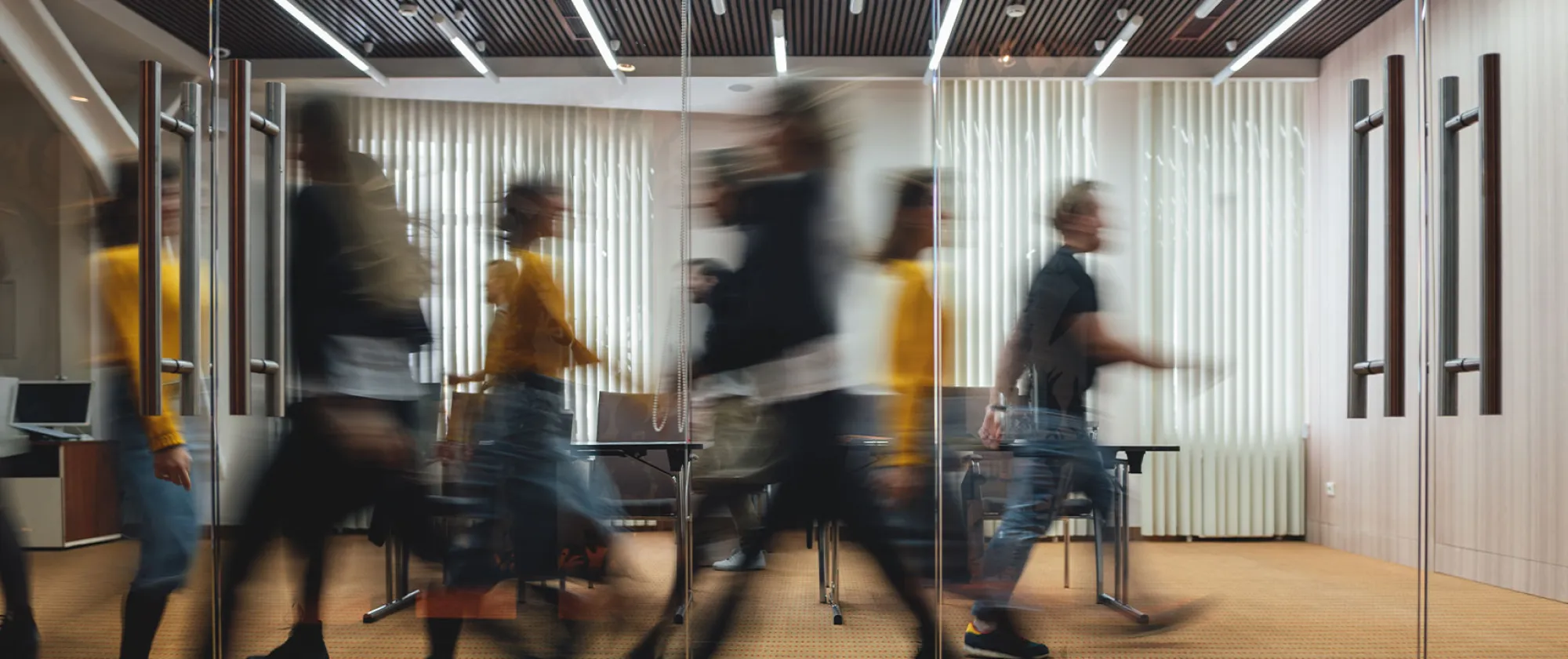 Group of business people walking in a office with motion blur effect