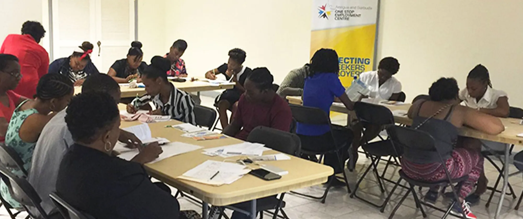 A group of people sitting at a workshop