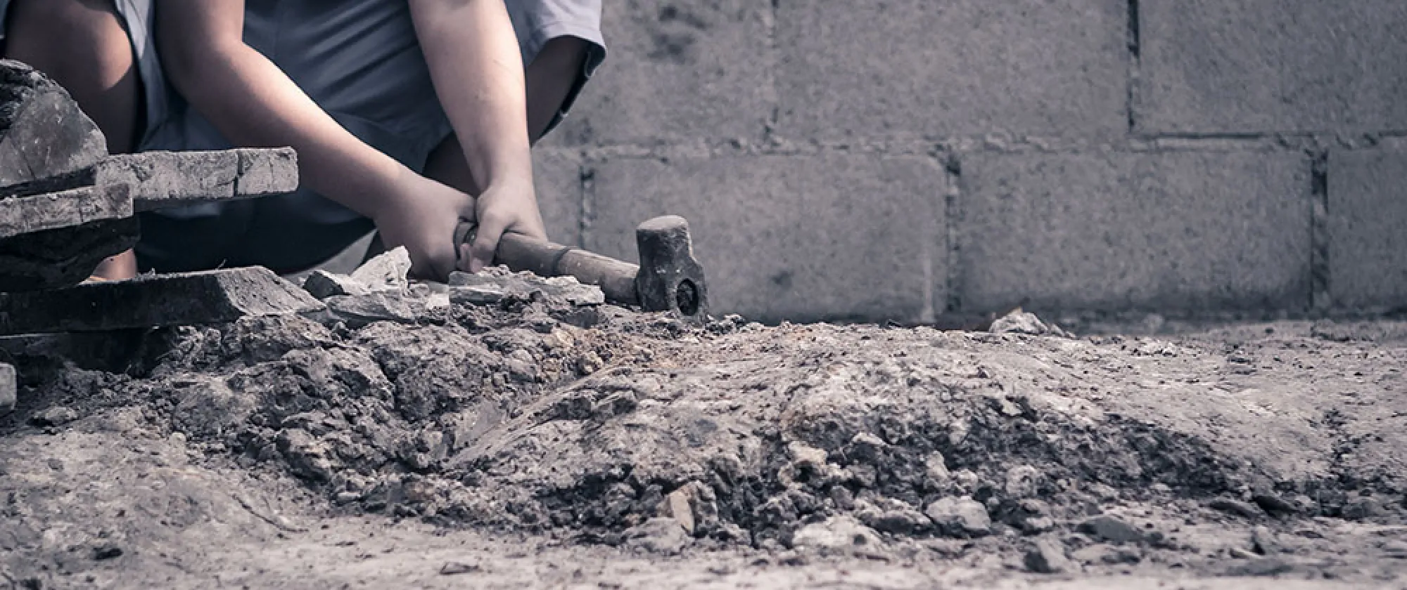 Young boy working in construction
