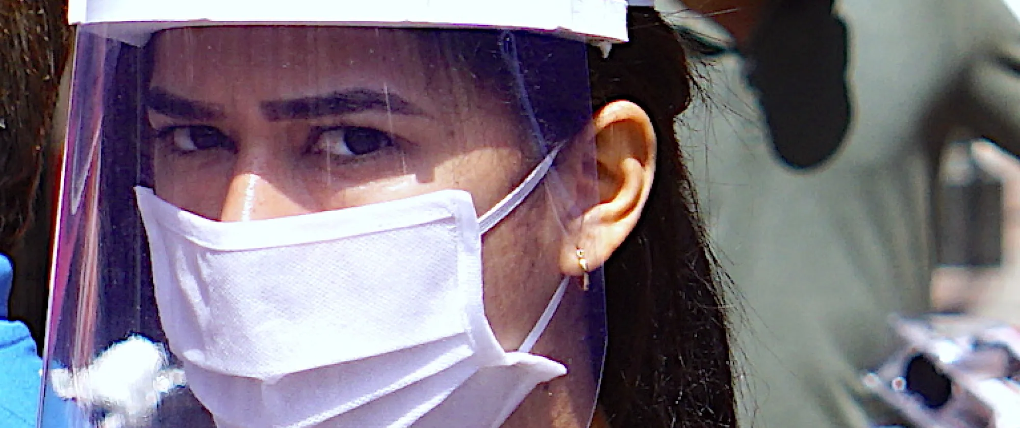 Girl in mask to secure from COVID-19