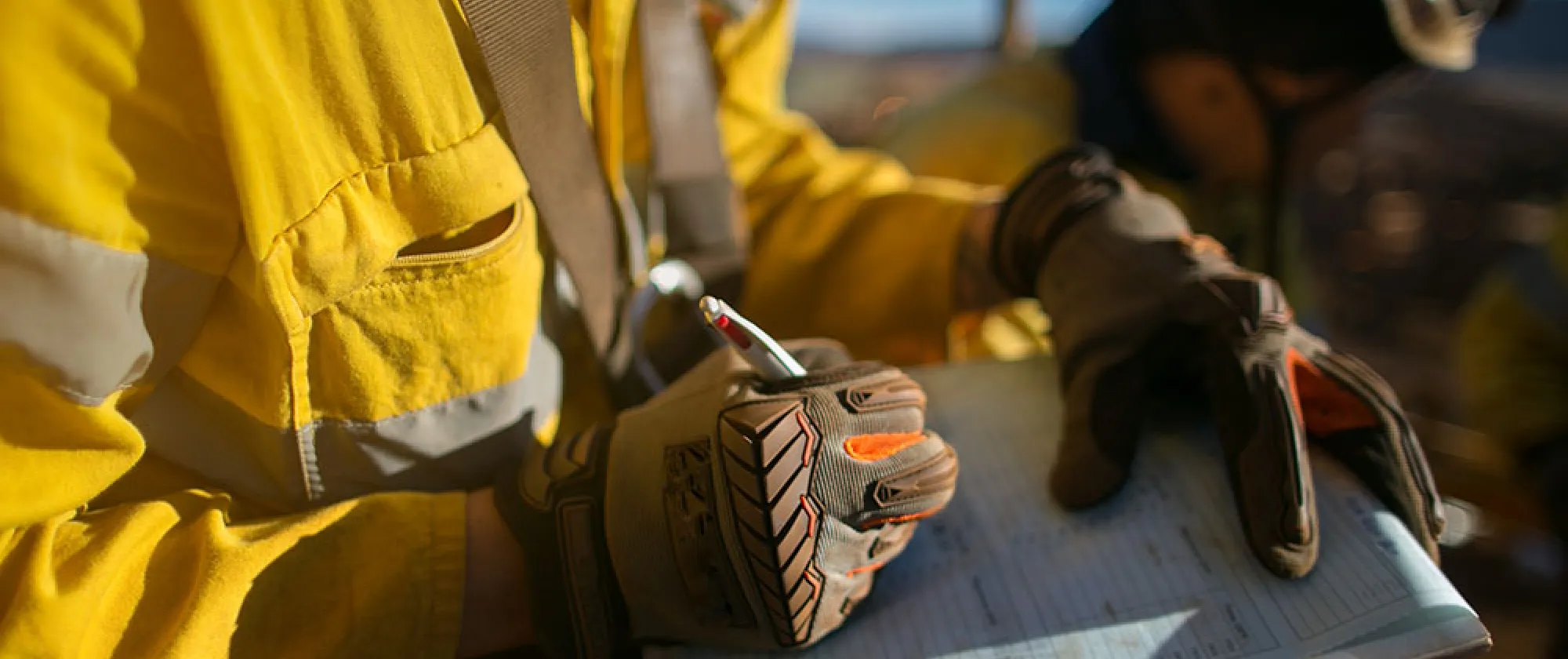 Worker with OSH checklist during assignment