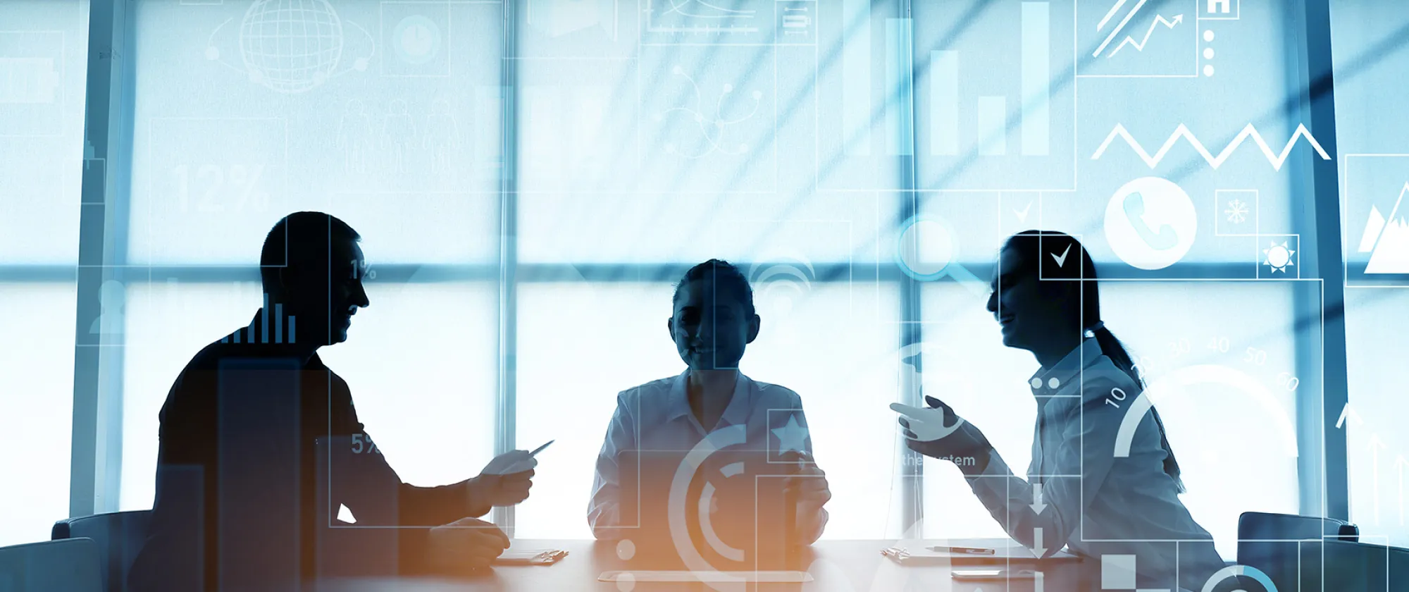 A man and two women coducting a business meeting in office