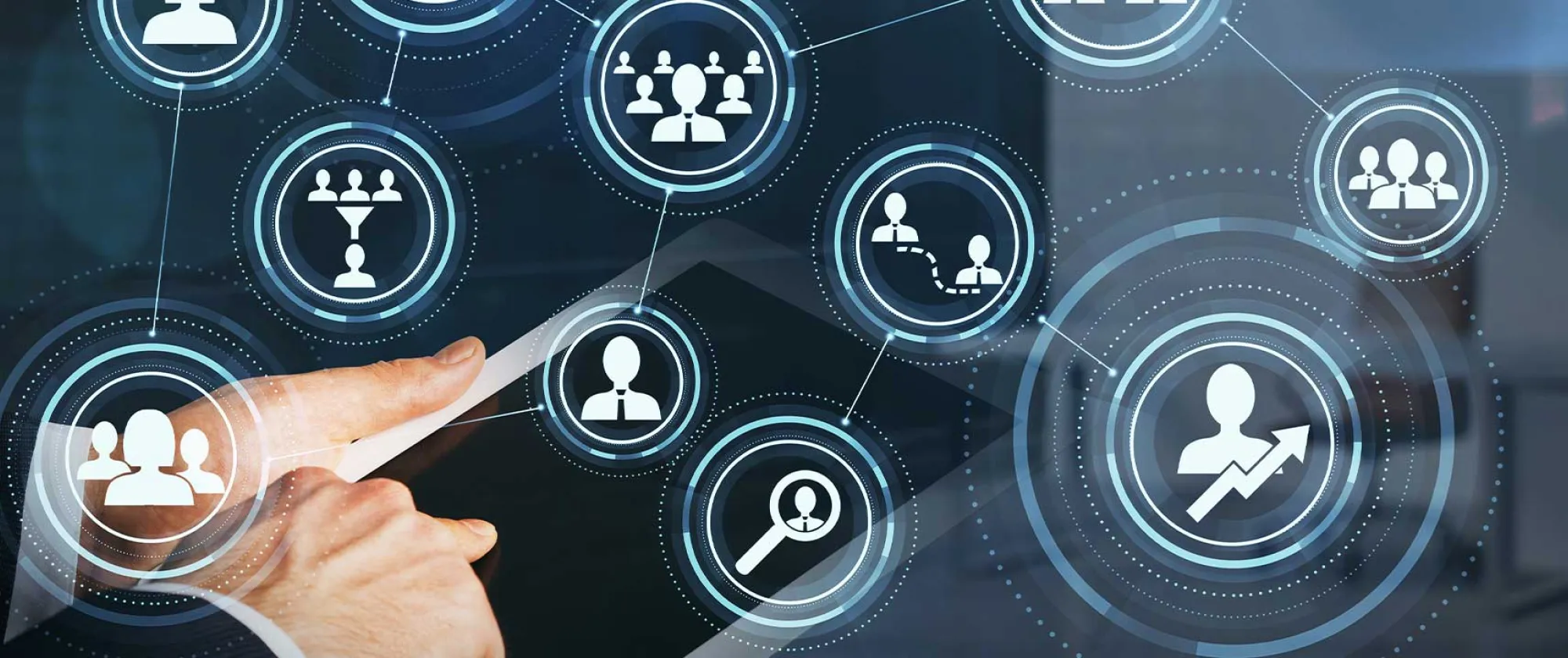 A businessman's hand in formal suit using tablet device with a virtual overlay concept depicting an alumni network