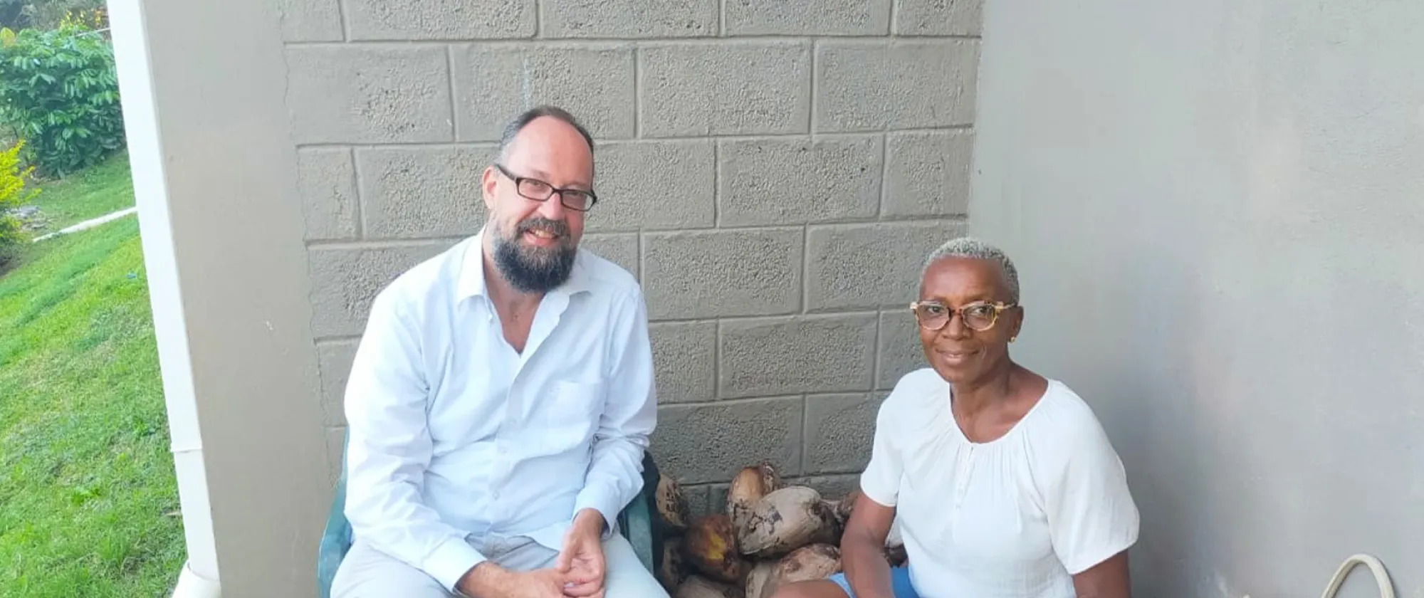 John Bliek, ILO Caribbean Specialist sitting with Stephanie Lewis, female entrepreneur in Grenada