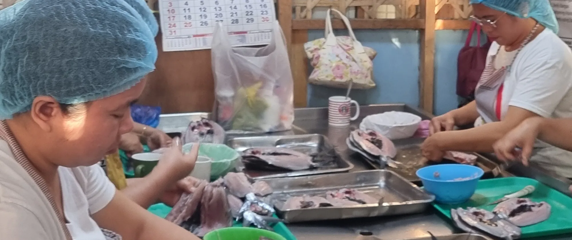 women debone and process milkfish