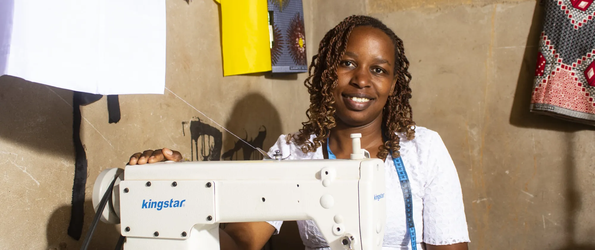 Seamstress in Zimbabwe behind her sewing machine