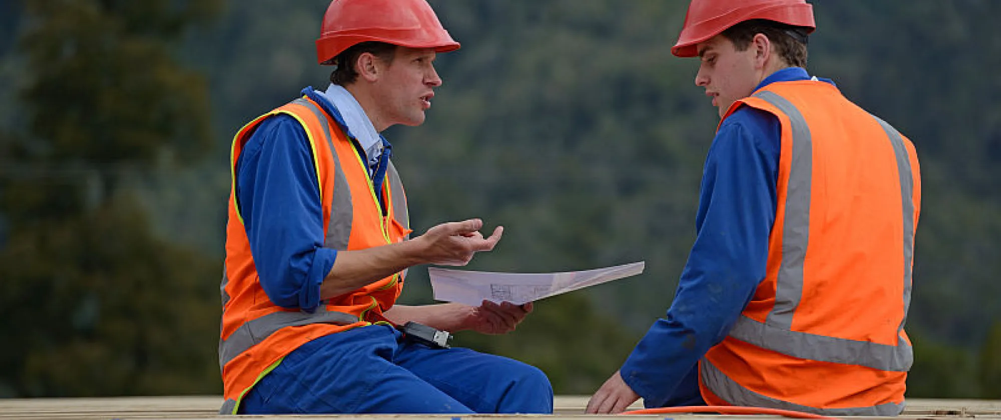 Electricians discuss the construction plan near Greymouth, New Zealand
