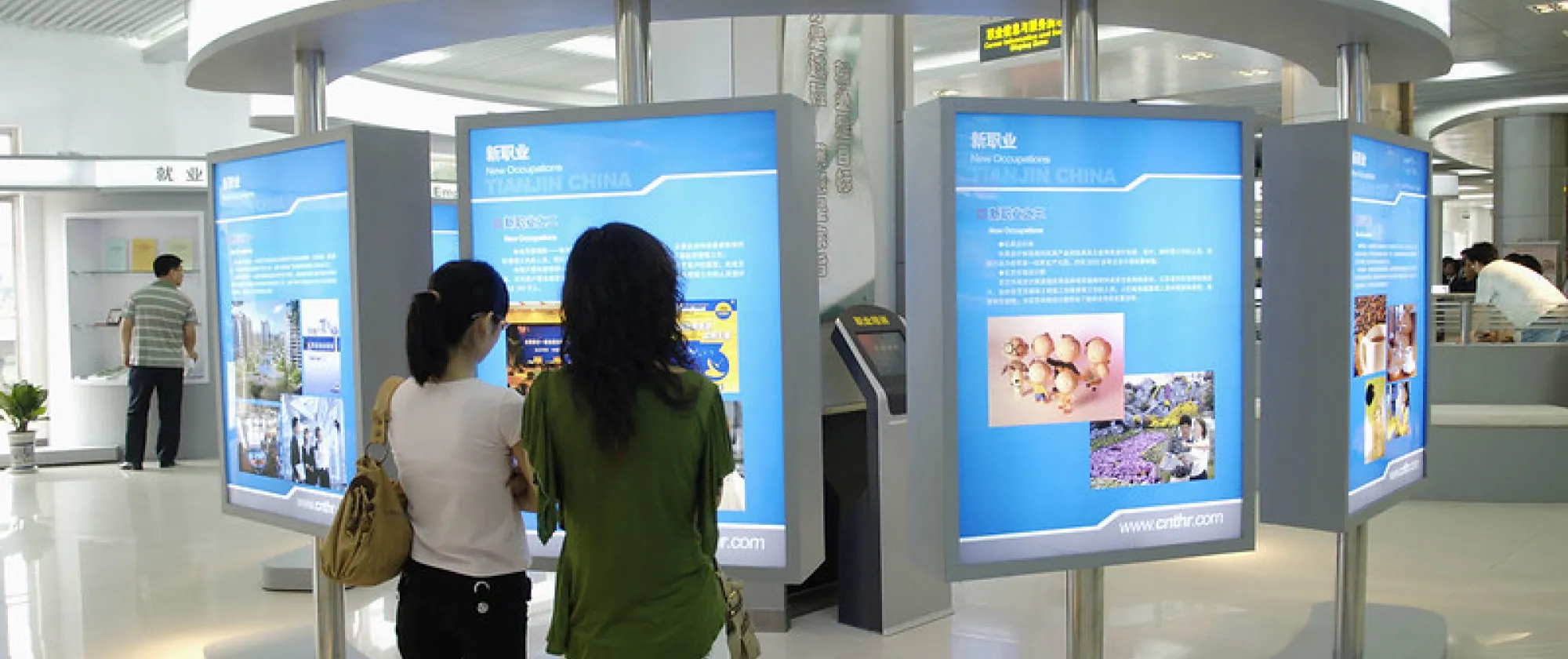 women looking at board