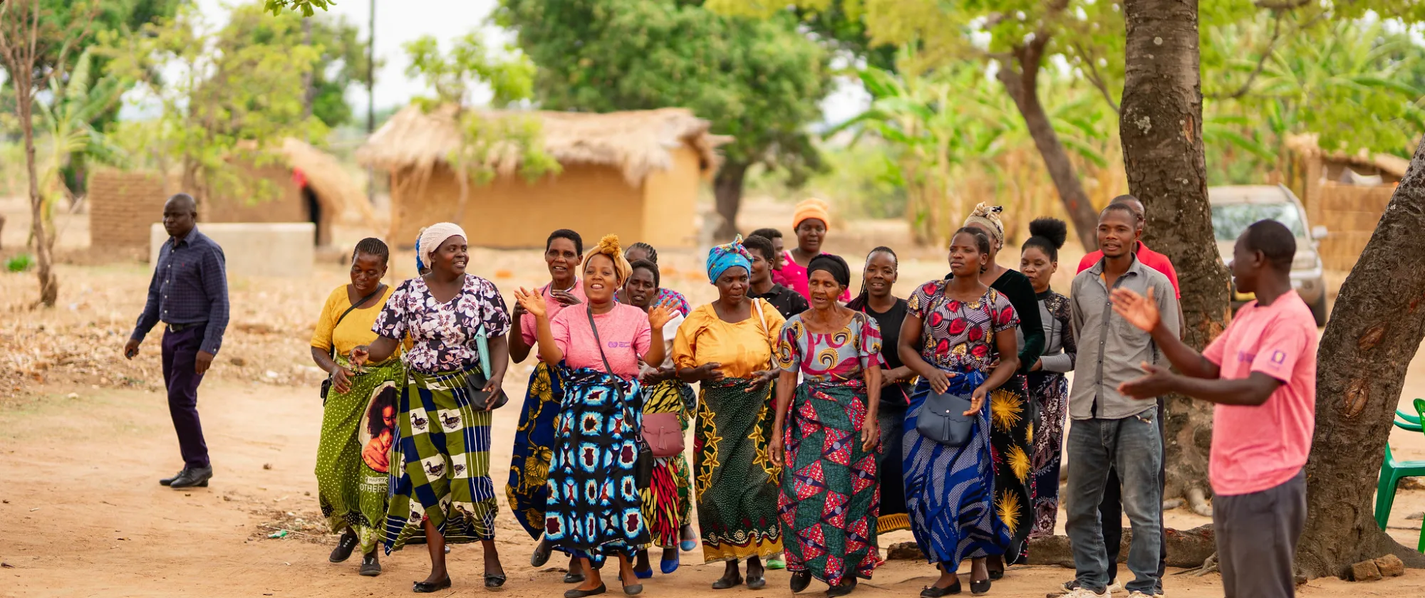 Women in Malawi dancing to receive visitors