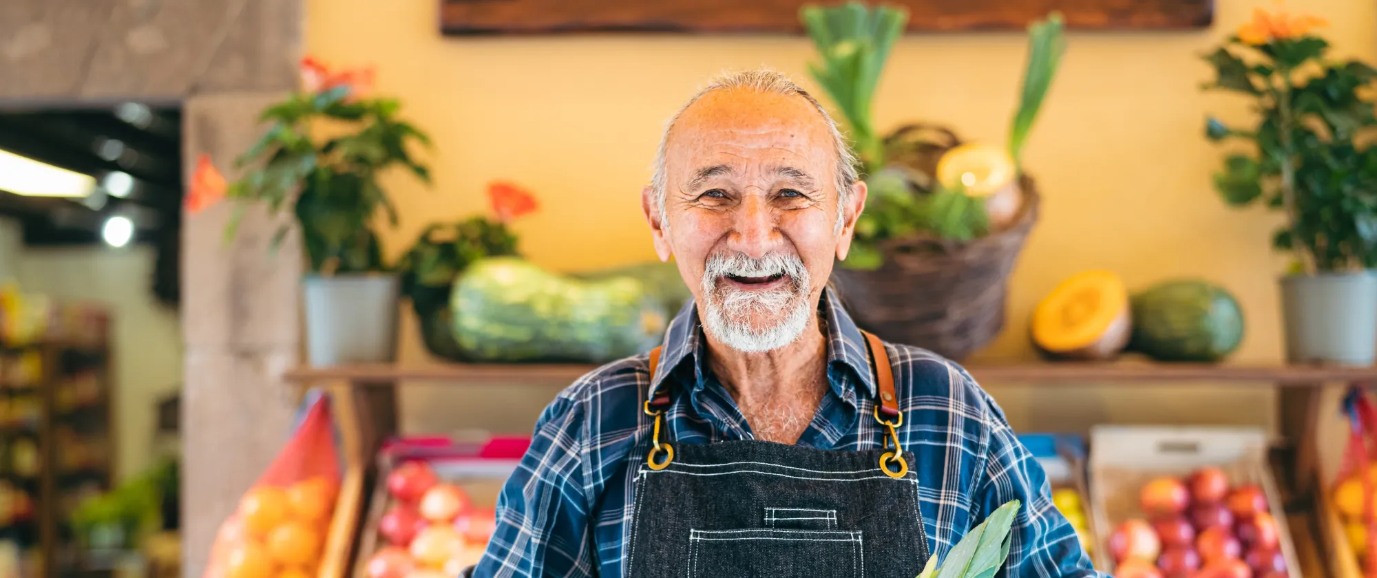 Elderly worker sells fruits. 