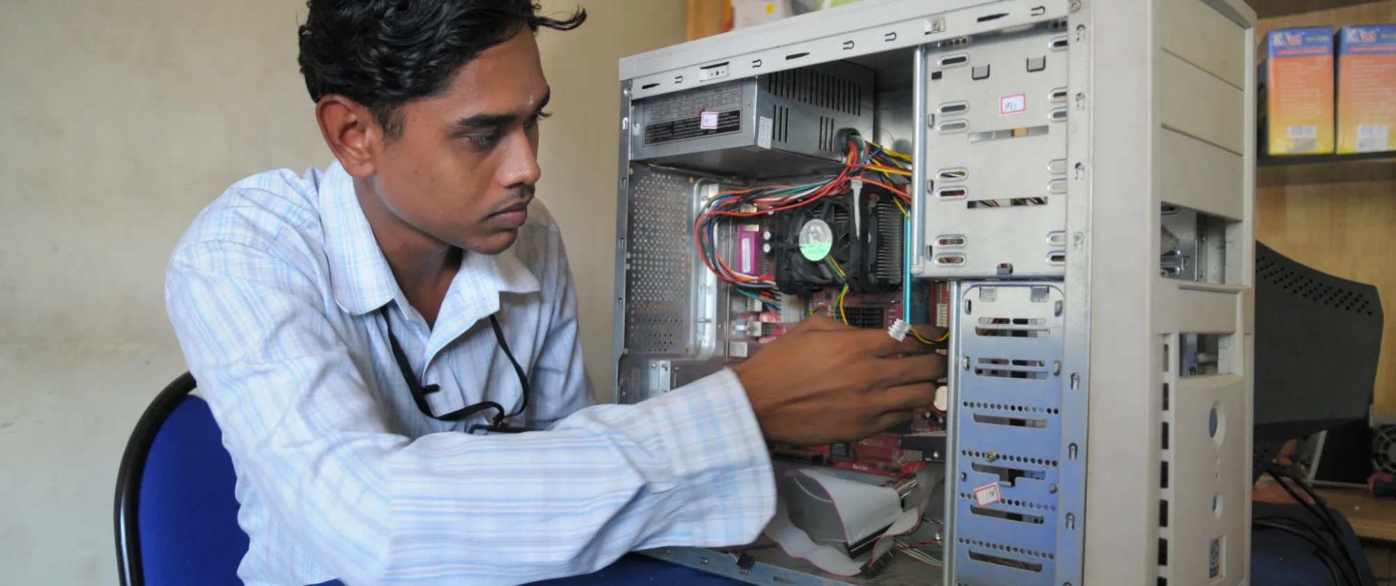 young man repairing computer