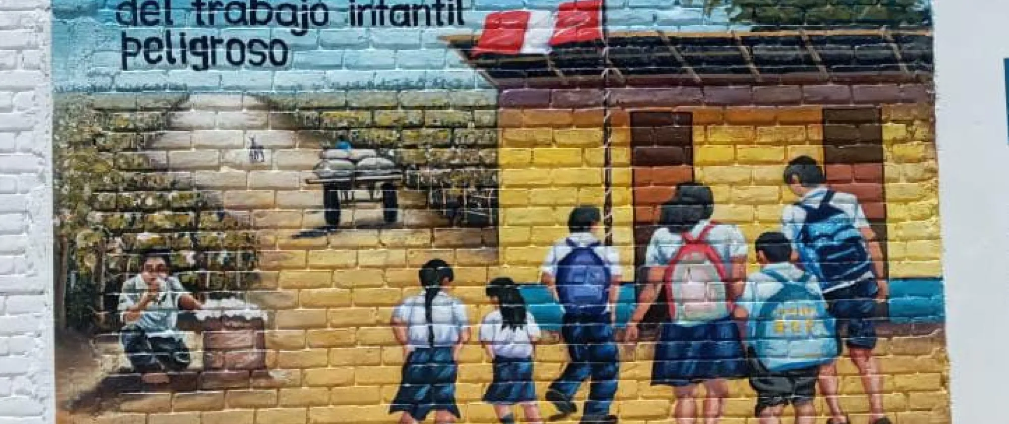 Mural painting depicting children going to school with a message on children's rights