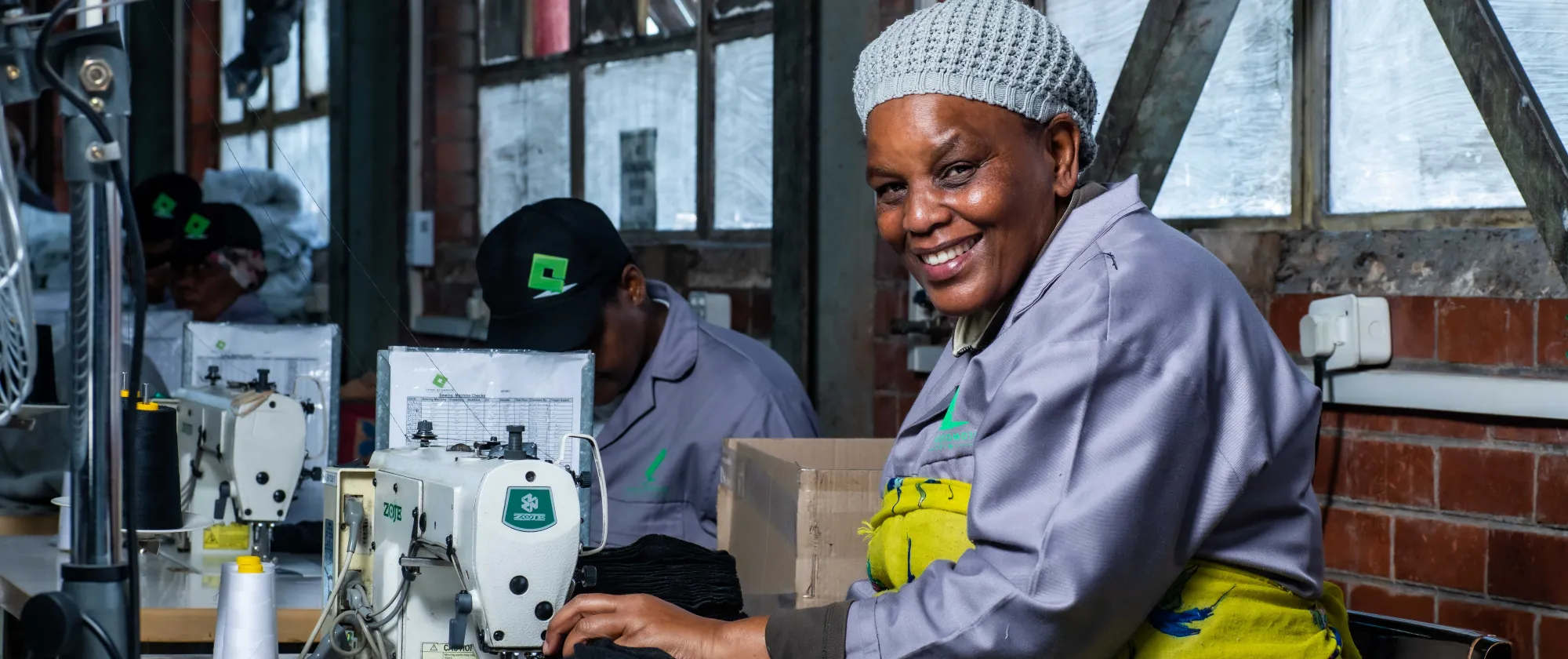 A seamster working at Expert Auto Trim in Durban, a Productivity Ecosystems for Decent Work programme beneficiary enterprise in the Automotive Sector