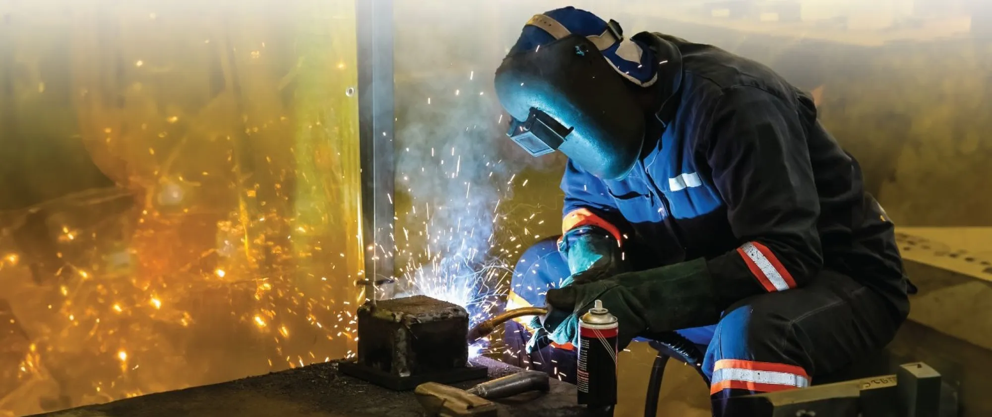A skilled worker in safety suits