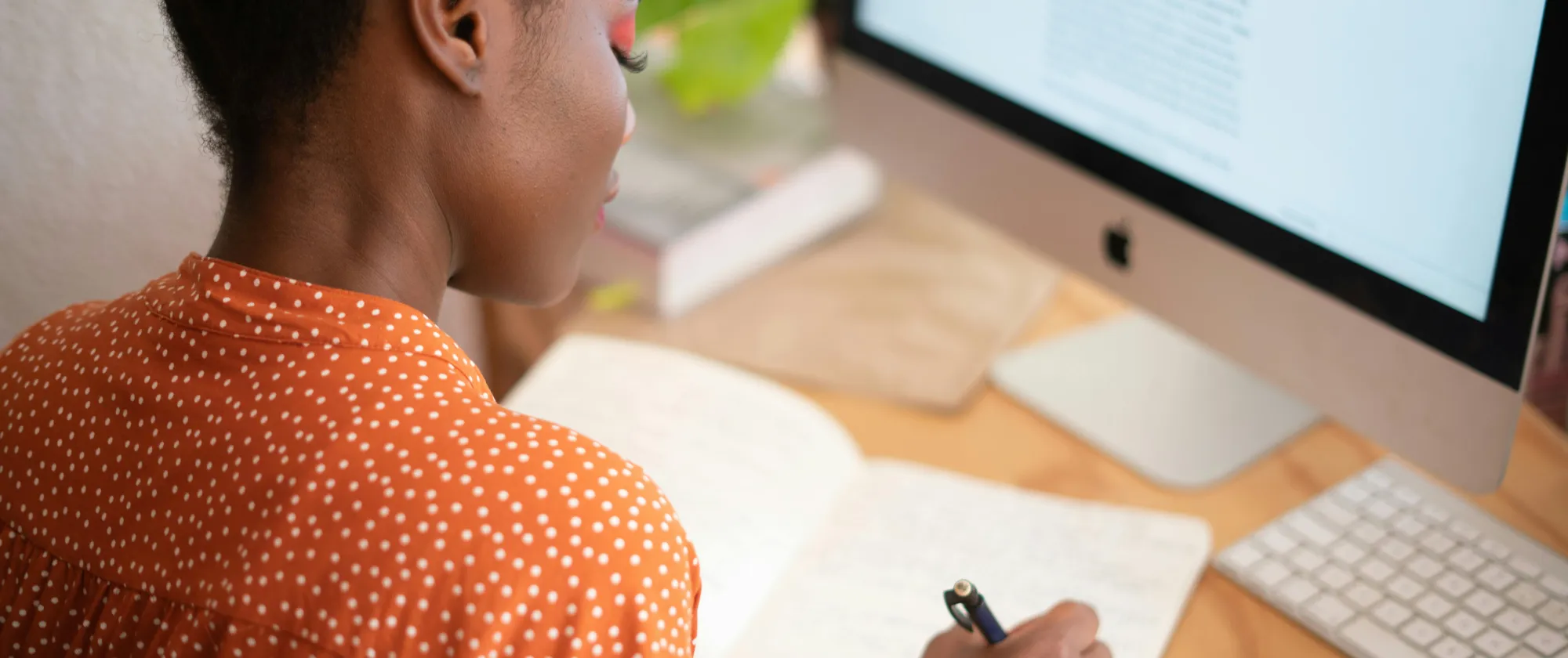 woman writing in notebook