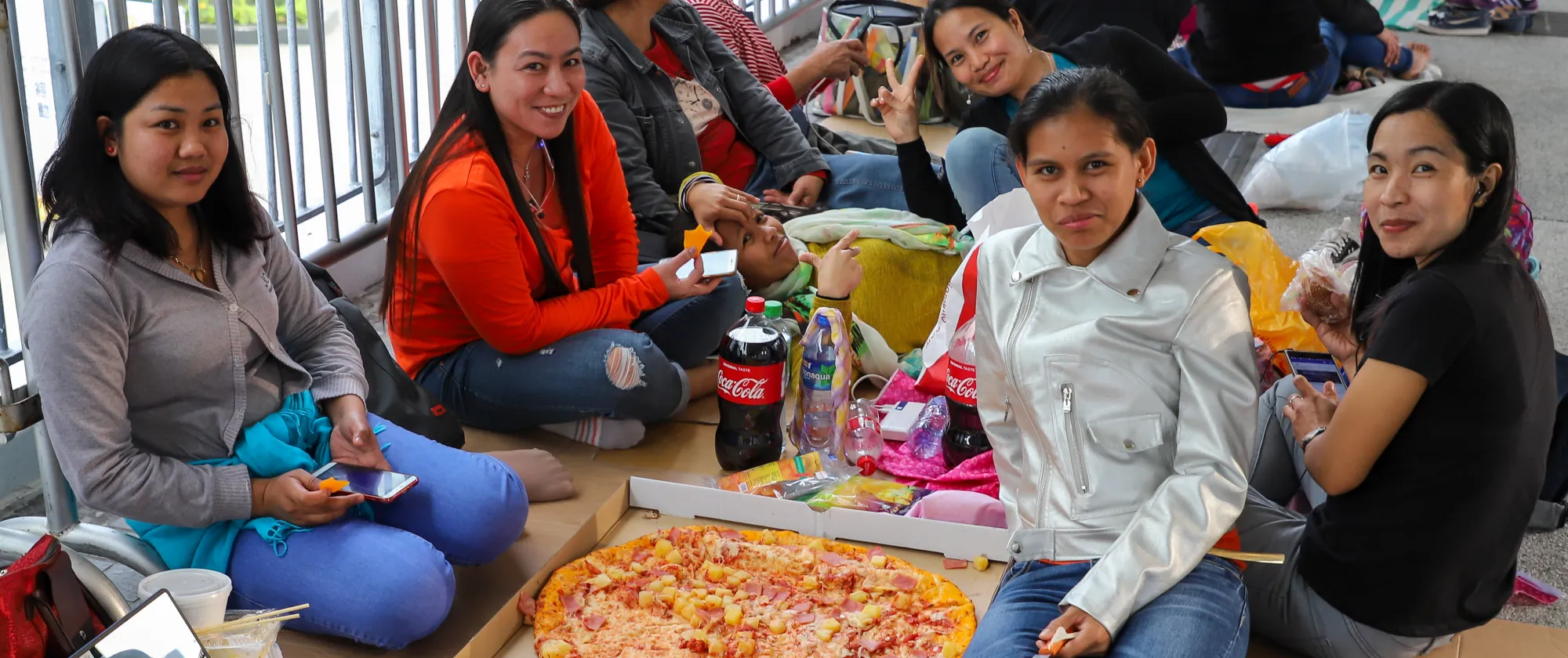Domestic helpers from Indonesia and Philippines enjoying their day off on a Sunday in Hong Kong (China)