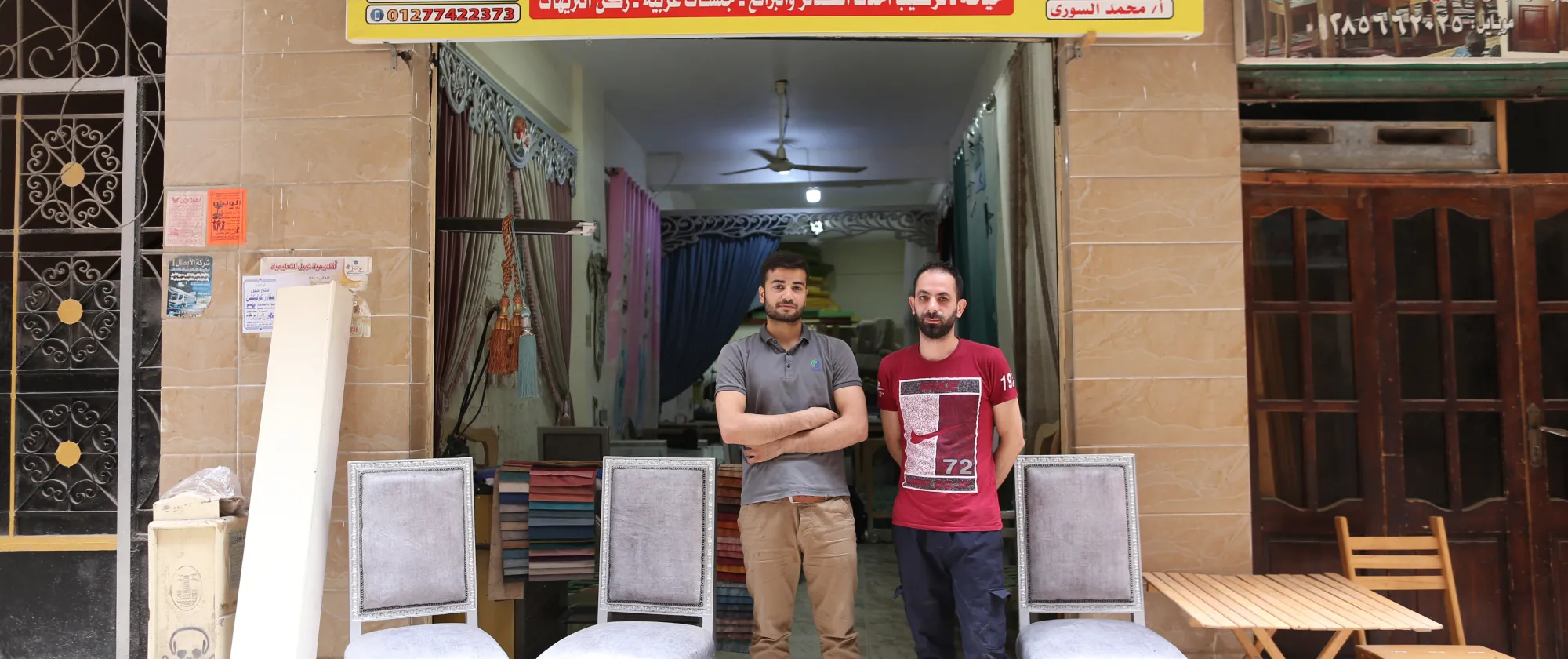 men standing outside shop