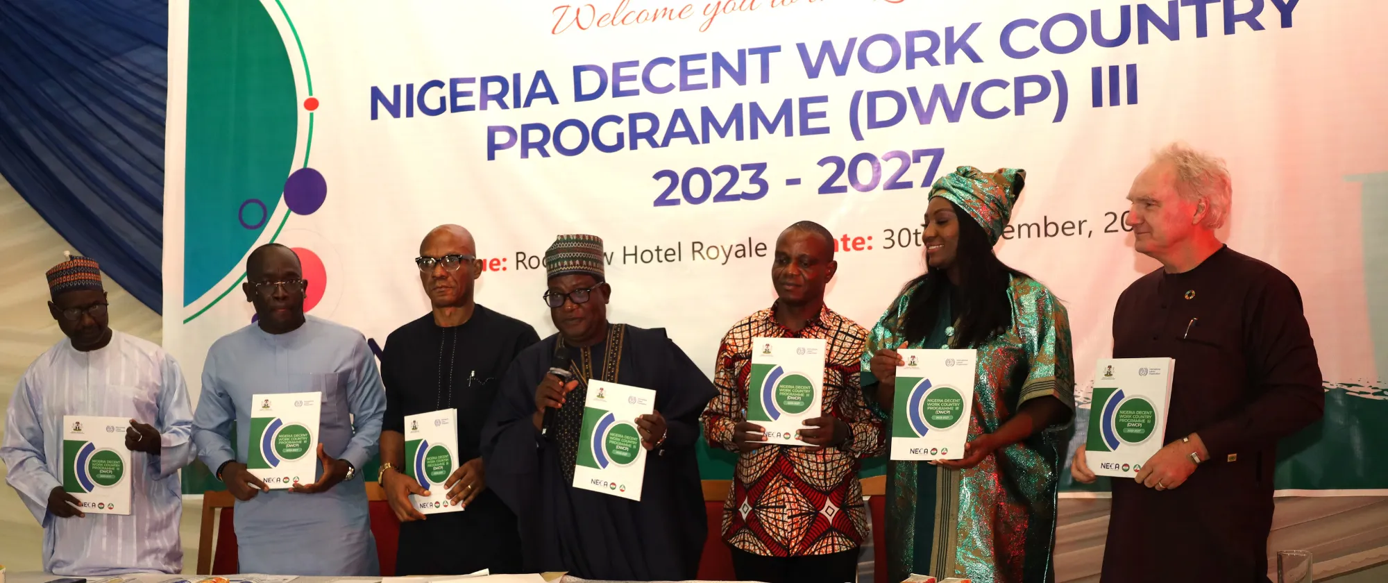 The Minister of Labour with the Social Partners, ILO CO-Abuja Director and UN Nigeria Resident Coordinator with copies of Nigeria DWCP III document at the Launch