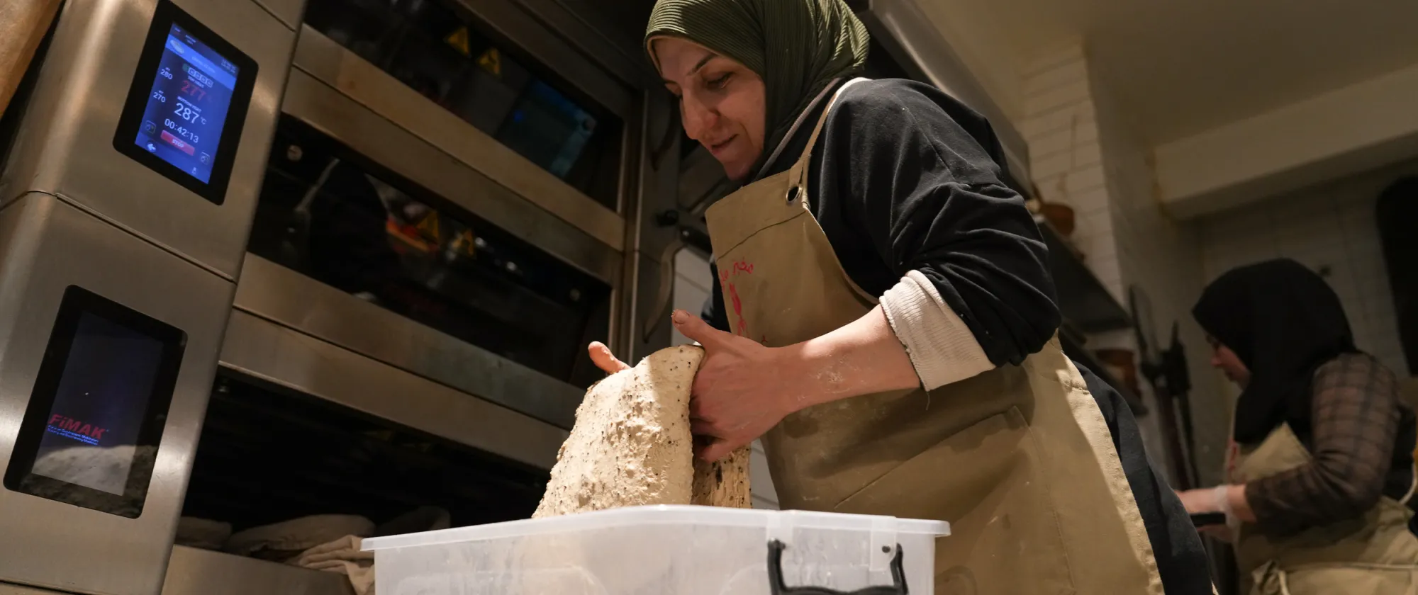 women at a bakery in Lebanon