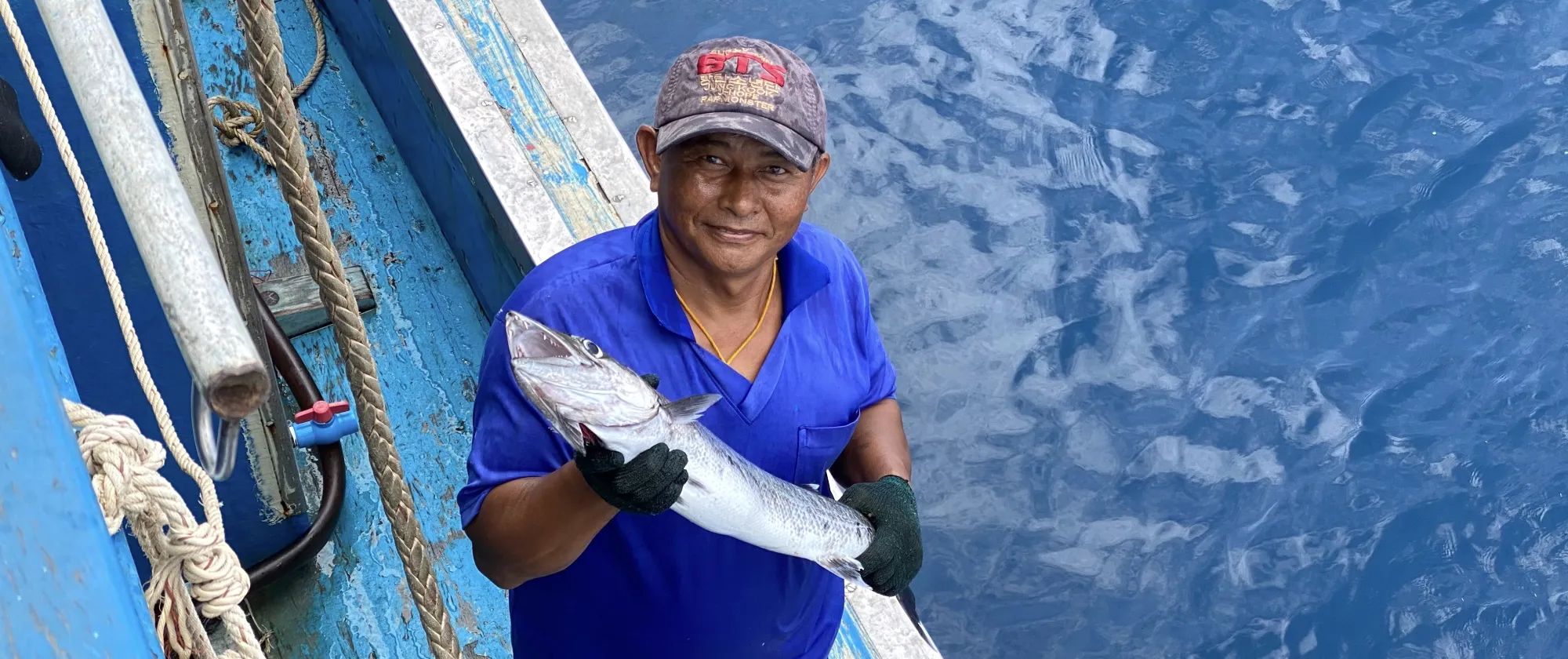fisher-holding-up-his-catch
