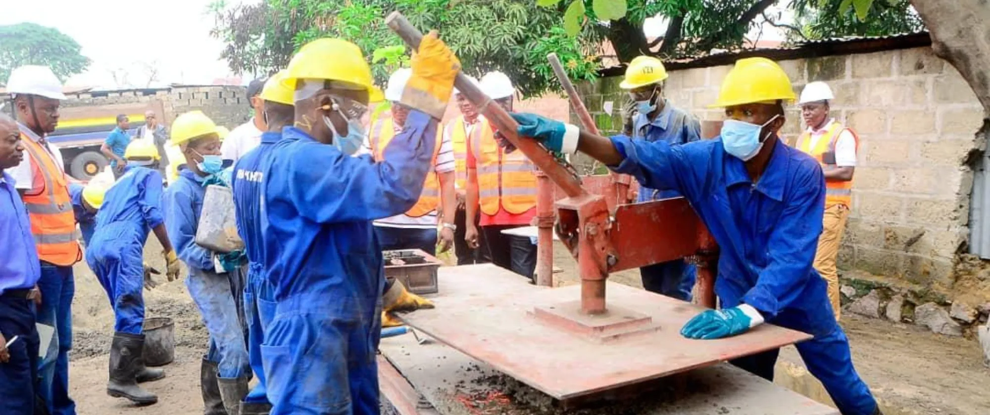 workers manufacturing paving stones