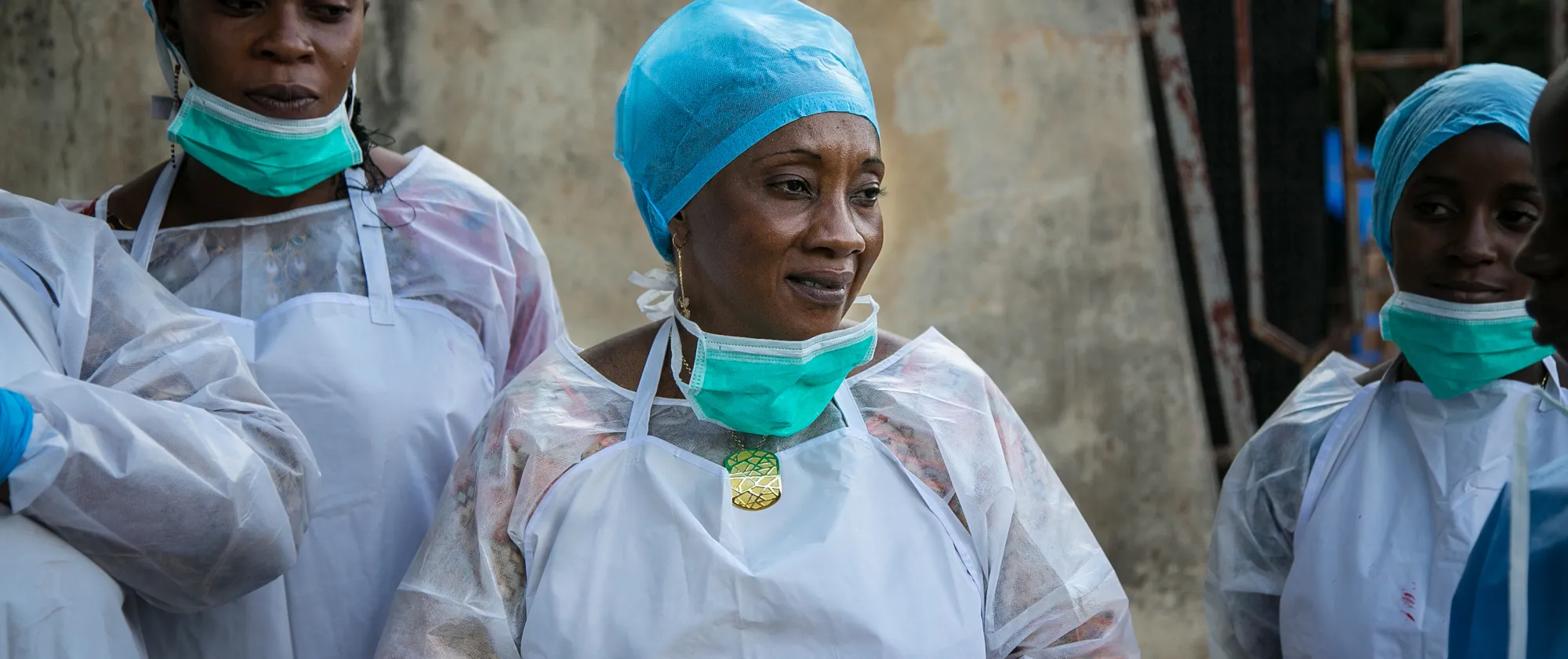 Public health workers learn how to use personal protective equipment at a CDC-GHSA facilitated training in Guinea.