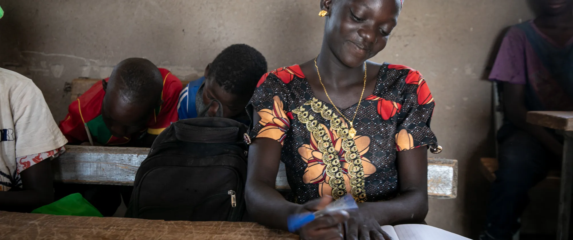 A young girl is studying in her class, Burkina Faso