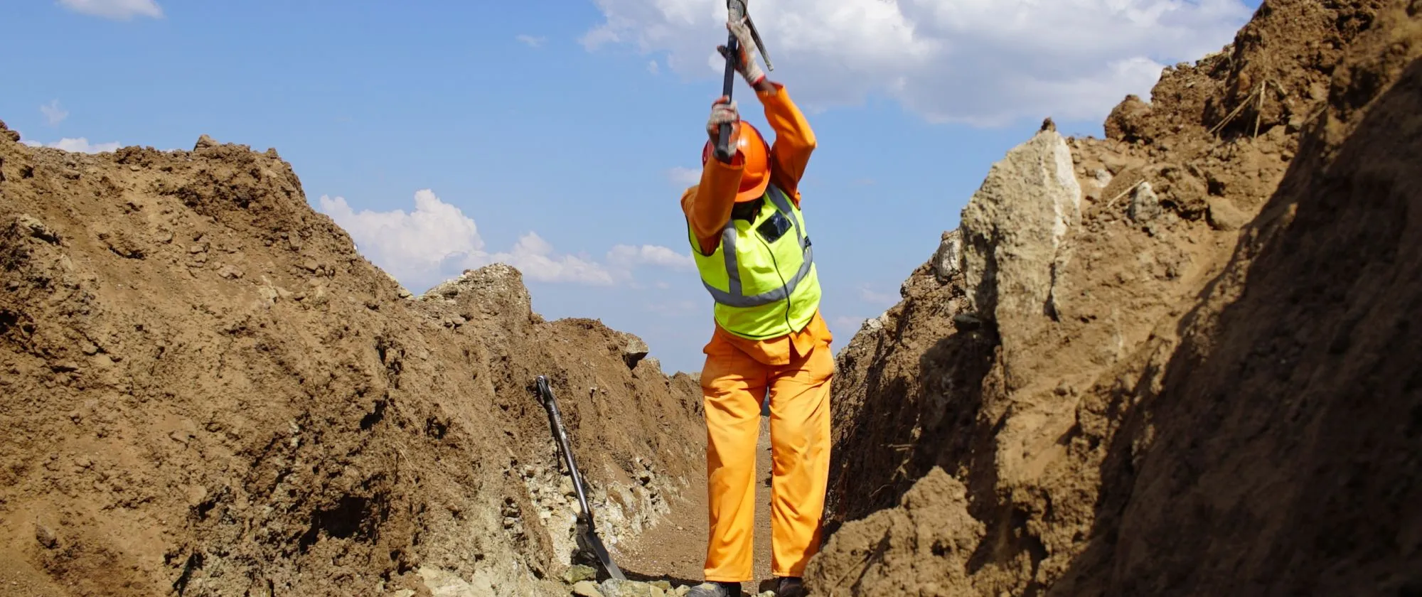 EPWP Worker digging a trench