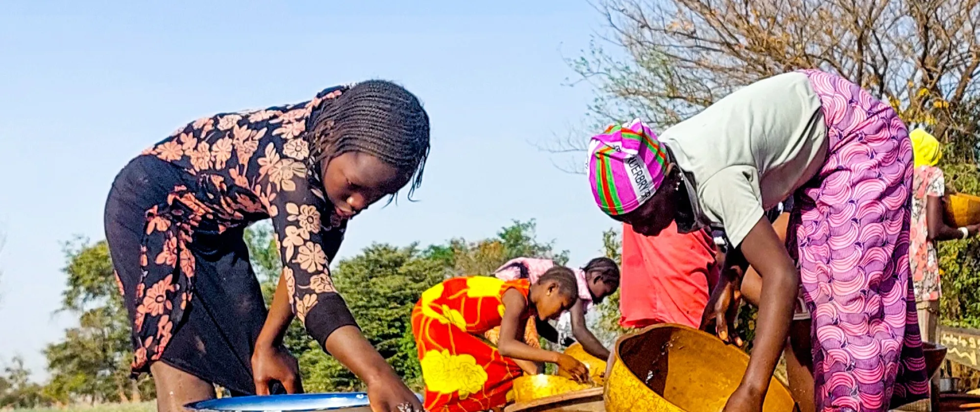 Women and girls are in an artisanal gold mine and pic water in buckets
