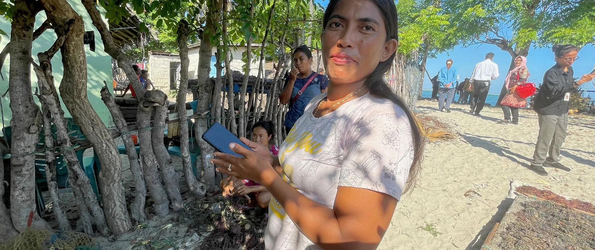 Diana Mahalebu shows the application that she uses for recording her seaweed production.