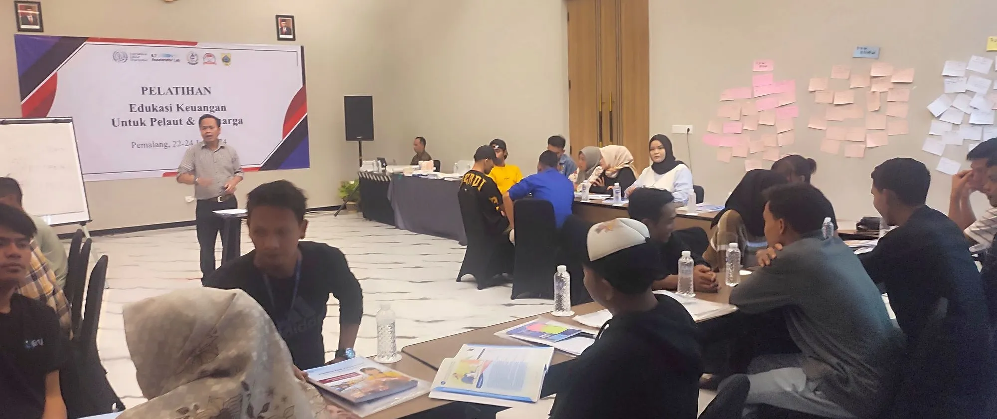 Participants of the financial education training programme for fishers and their families in Pemalang, Central Java, Indonesia, during one of the sessions.