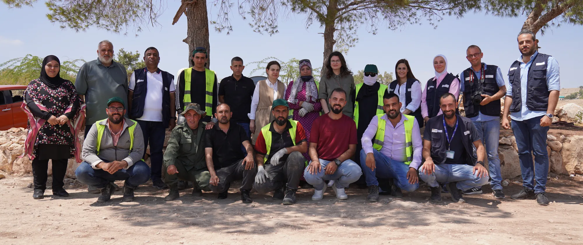 ILO, Ministry of Agriculture, and Al Koura directorate representatives and afforestation site workers, meet at the Al Koura afforestation site.  