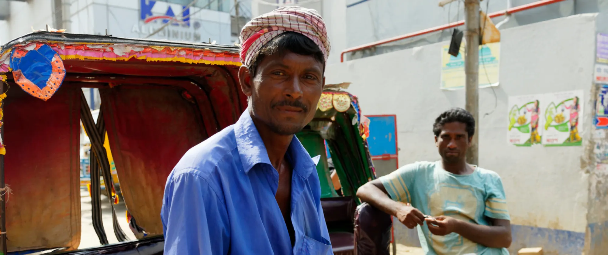 Rickshaw drivers are seen waiting for their next customers in Dhaka.