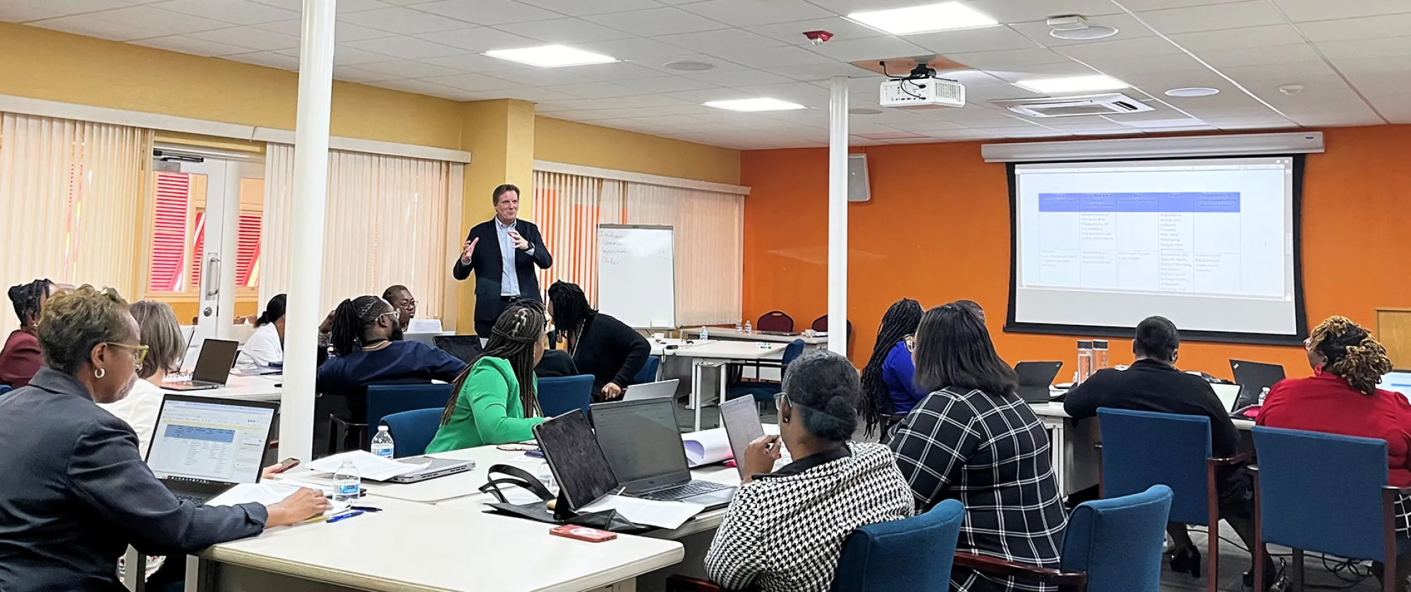 Gentleman addressing group at workshop