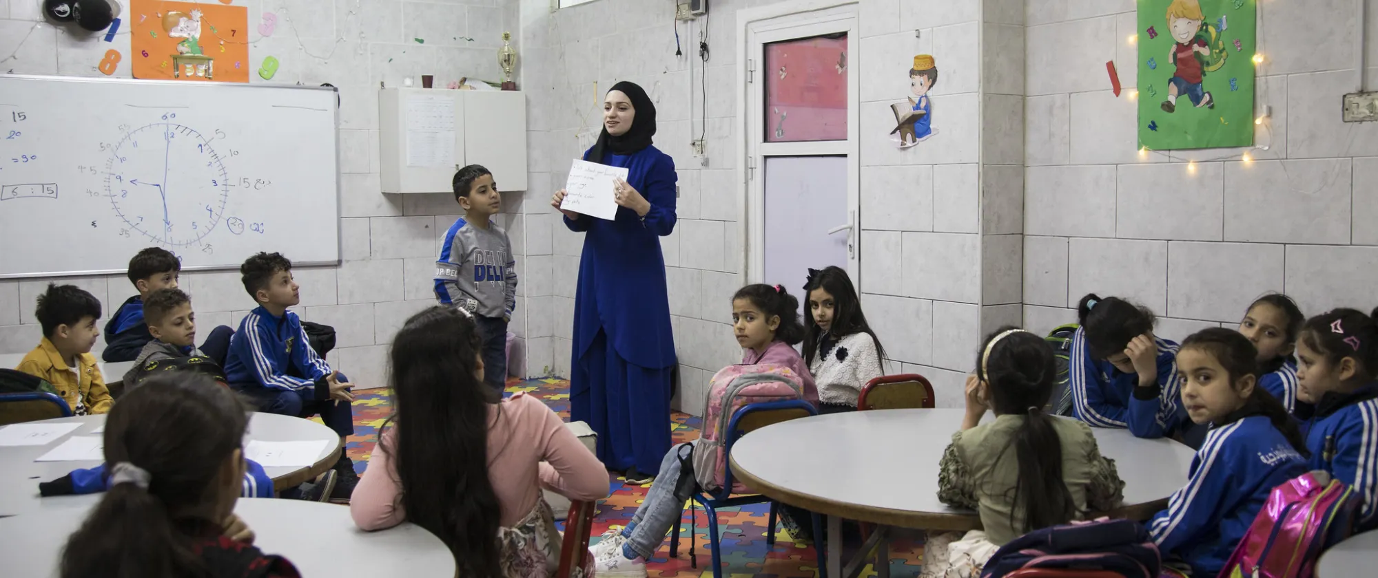 woman teacher and kids in classroom