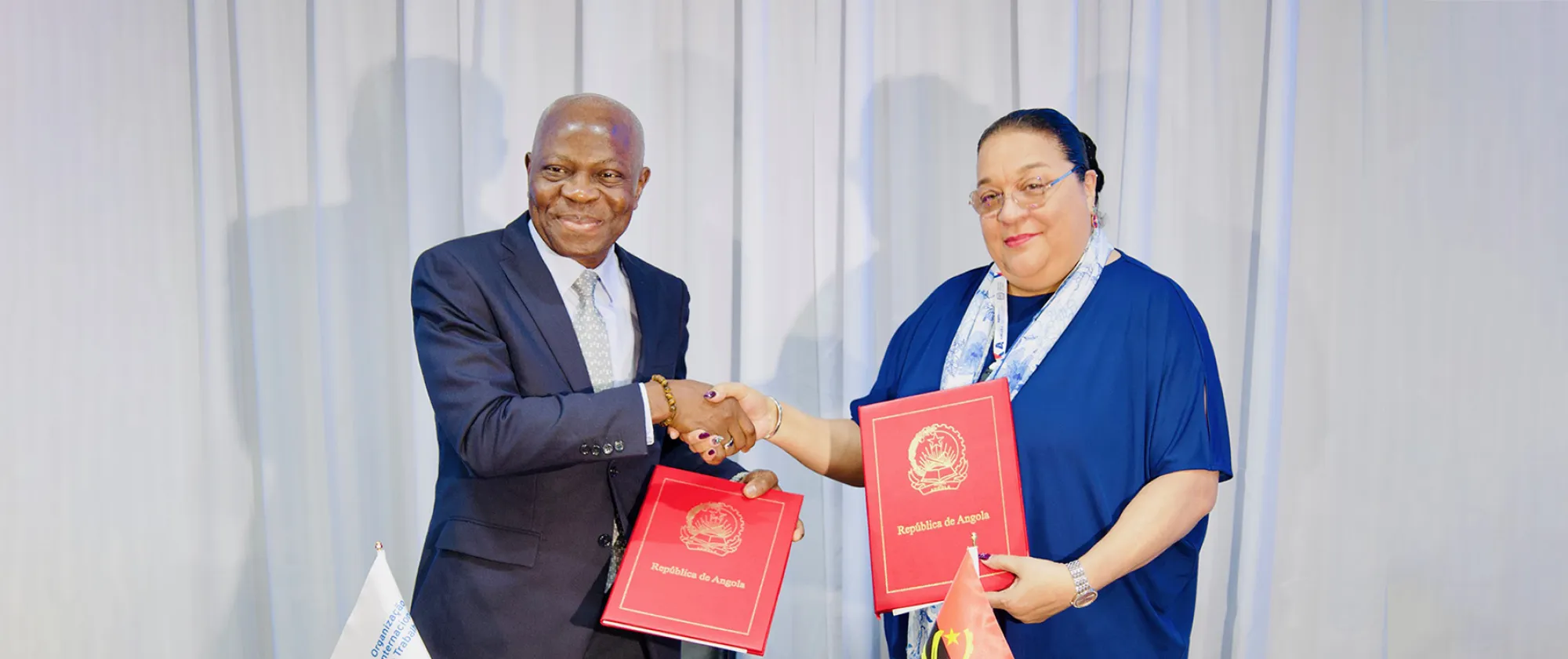 Minister of Public Administration, Labour and Social Security of Angola, Teresa Dias Rodrigues, with ILO Director-General Gilbert F. Houngbo, shake hands after signing of country office agreement in Luanda