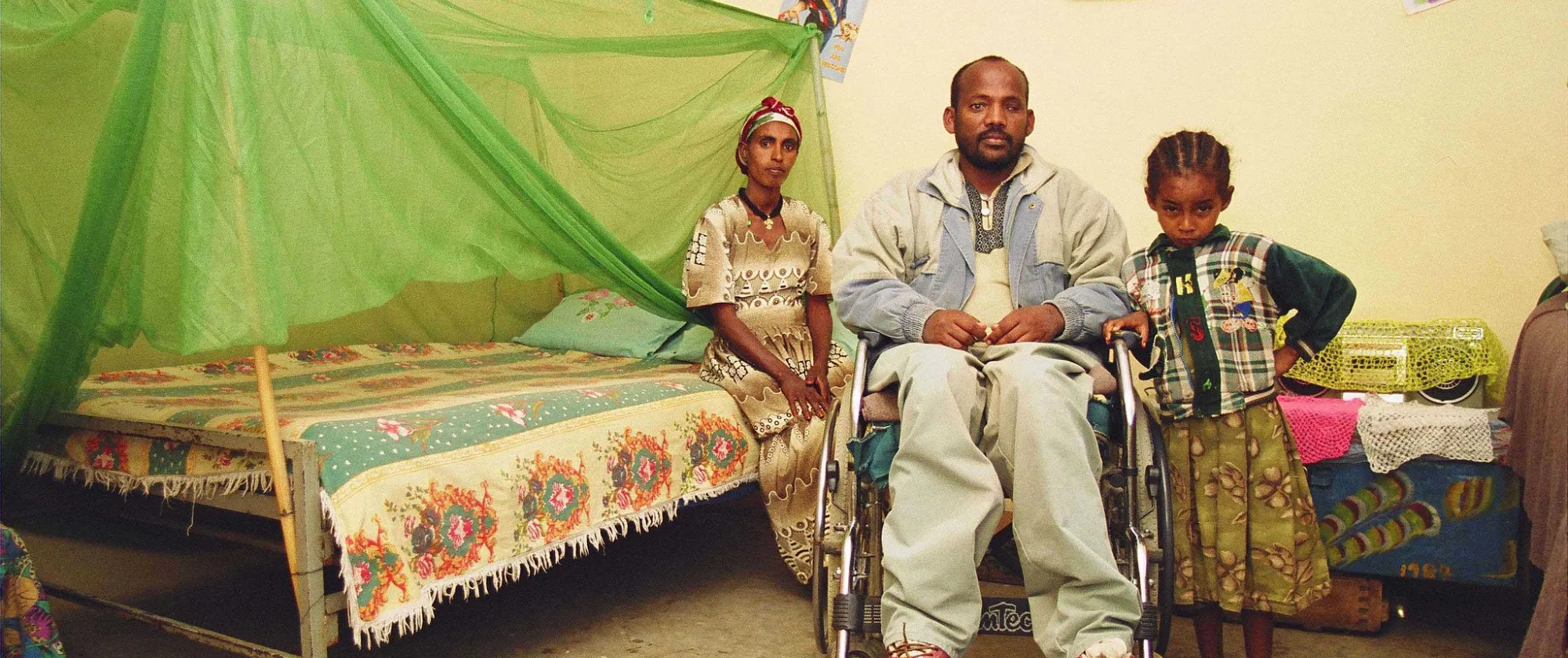 A man with a mobility impairment with his children
